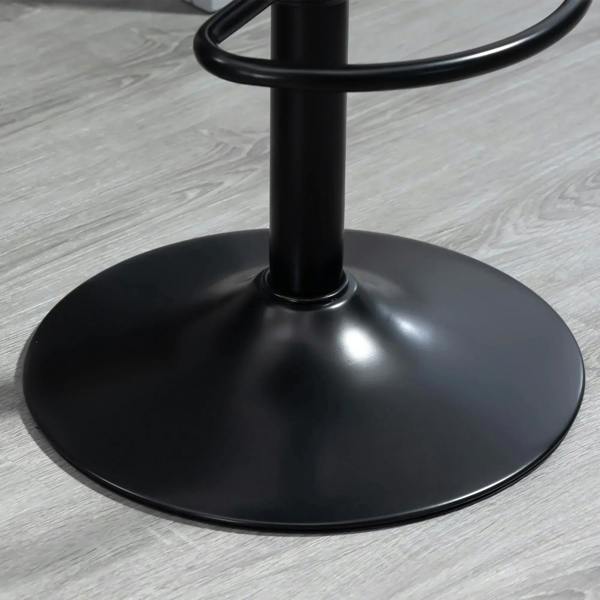 Black round base of a bar stool with central support pole