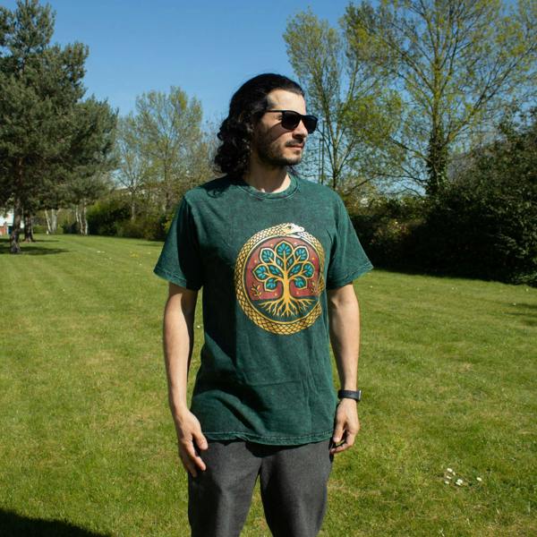 Green Tree of Life graphic T-shirt with crew neck and short sleeves on model.
