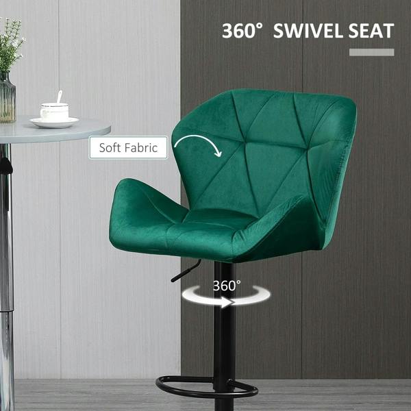 Green velvet bar stool with tufted seat and 360° swivel base, black footrest ring