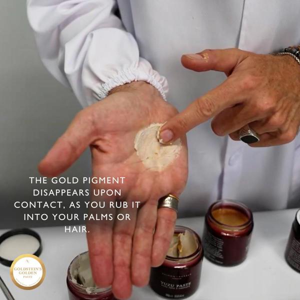 Andy Goldstein applying a gold pigment to his palm with text about its disappearance upon contact.