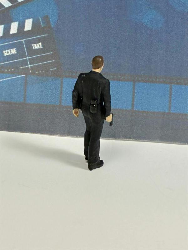 a toy figure of a man in a suit