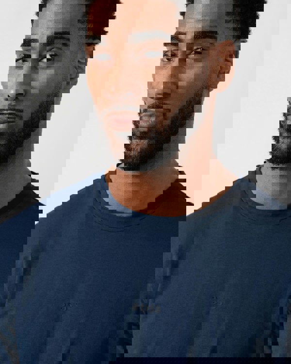 Model wearing BOSS Orange Tchark Long Sleeve Stretch Cotton T-Shirt in Open Blue 464 -  detail