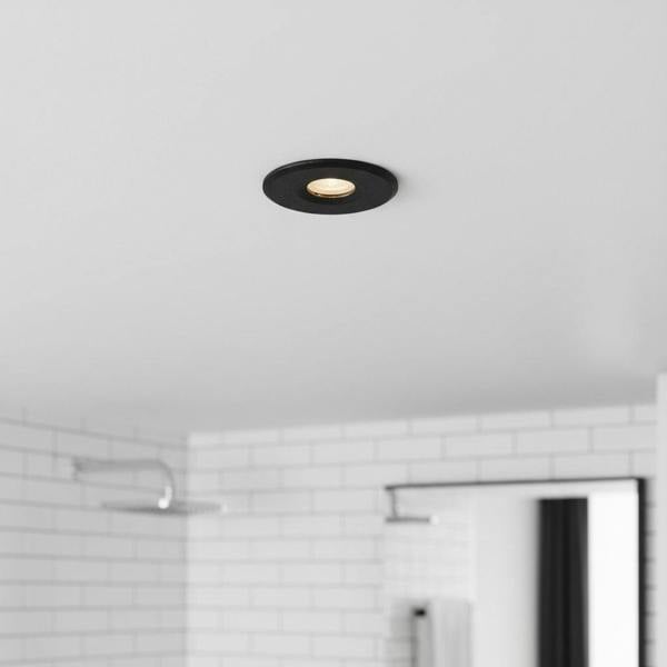 black mini recessed spotlight lamp installed in a modern bathroom