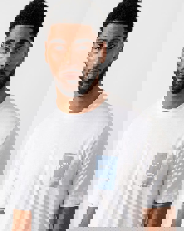 Model wearing BOSS Orange Mens TePlain T-Shirt in White 100 - detail