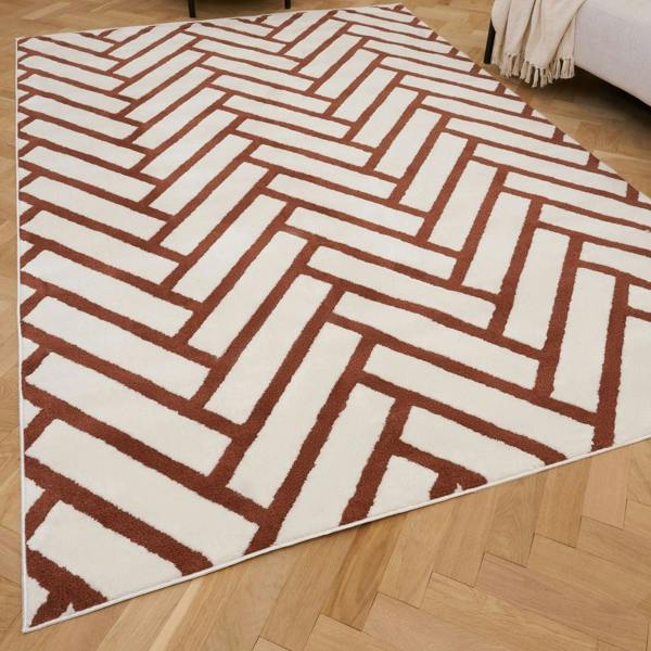 Rug with a herringbone pattern on a wooden floor