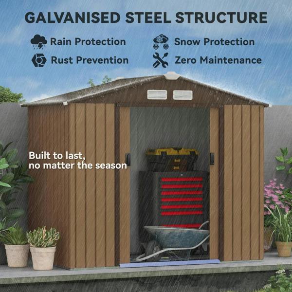 Light brown metal storage shed with apex roof and front door opening