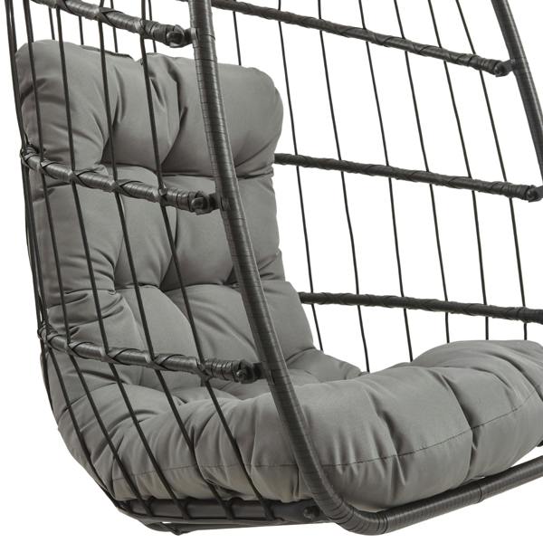 Black rattan hanging egg chair featuring a plush gray cushion, designed for comfort and stylish outdoor relaxation