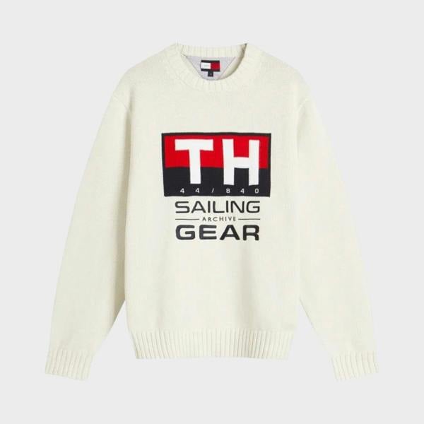 Supplied Fashion Tommy Hilfiger white crewneck knit sweater featuring a nautical sailing gear graphic logo on the chest