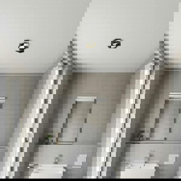 black recessed bathroom spotlight installed in a small modern bathroom 