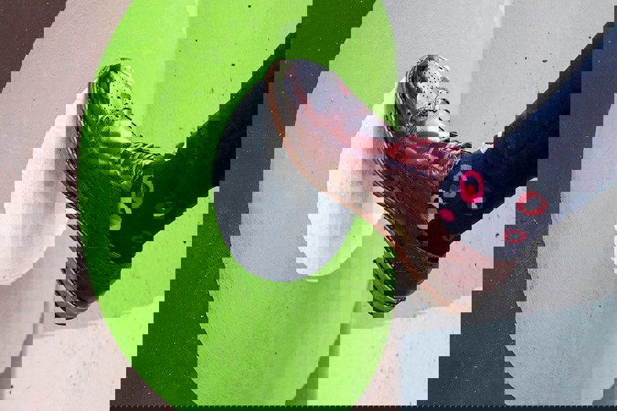 Person wearing red brogue shoes with spot design cotton socks