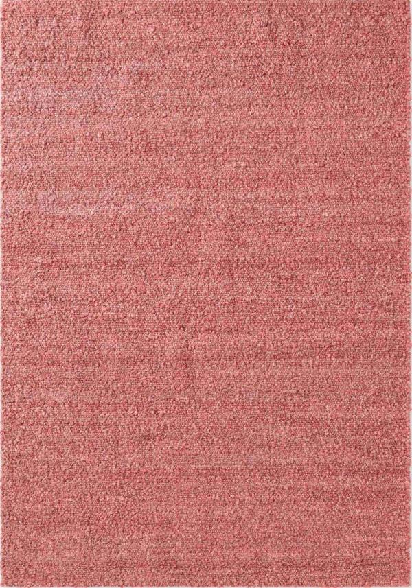 Solid pink rug with a subtle texture on a plain background
