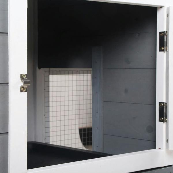 Grey wooden rabbit hutch door opening showing black tray and wire-mesh interior