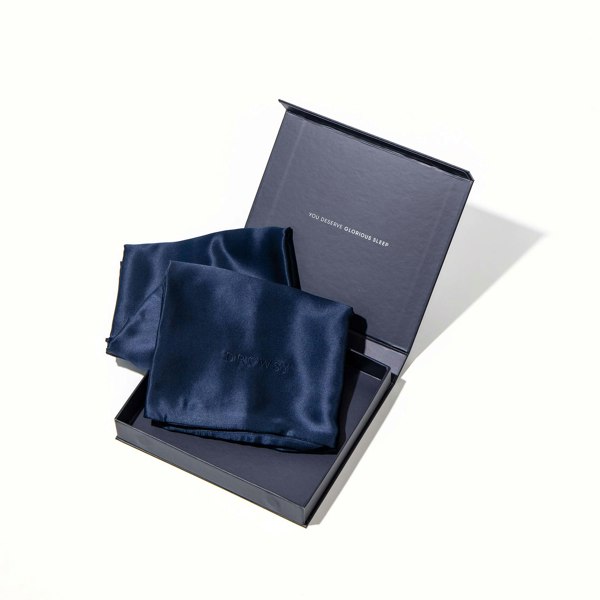 Blue pillowcase box opening with blue silk pillowcase inside