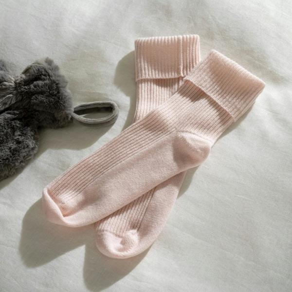 Blush Pink Supreme Cashmere Bed Socks styled in a bedroom 1 | Soak and Sleep