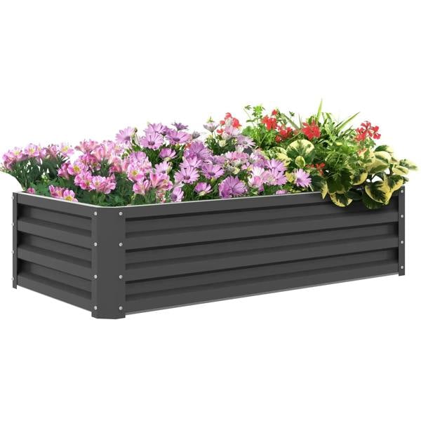 Light grey rectangular raised garden bed with flowers and leafy plants on top