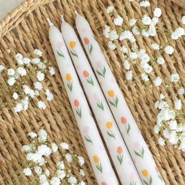 Set of three tulip-print taper candles, white with pink and orange tulip motifs
