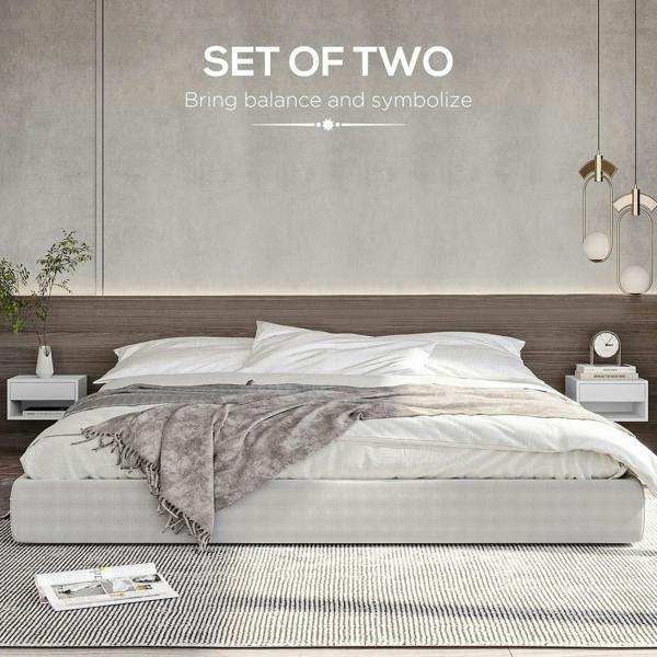 Set of two white floating bedside tables with open shelves and drawers for wall mounting