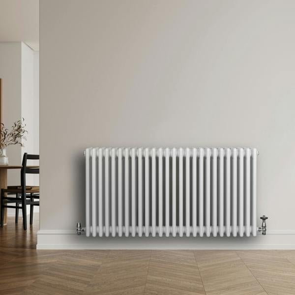 Traditional 4 column radiator in white, 600 x 1190mm, featuring a sleek design with smooth, glossy finish against a modern interior backdrop