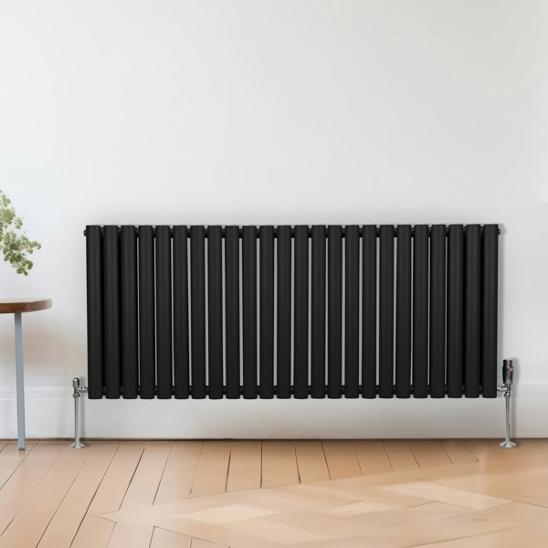 Sleek black thermostatic radiator valves with chrome accents, designed for modern heating systems, enhancing any interior decor