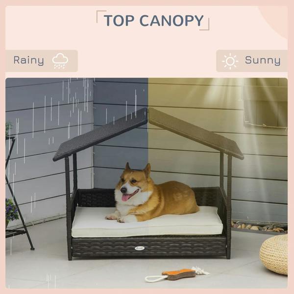Wicker dog house with top canopy roof, dark frame and cream cushion, dog resting