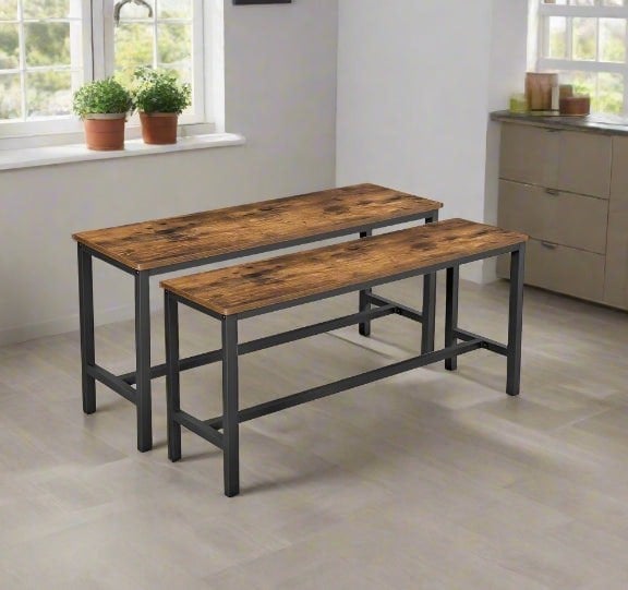 Rustic brown wooden benches with black metal frames styled under a modern dining table

