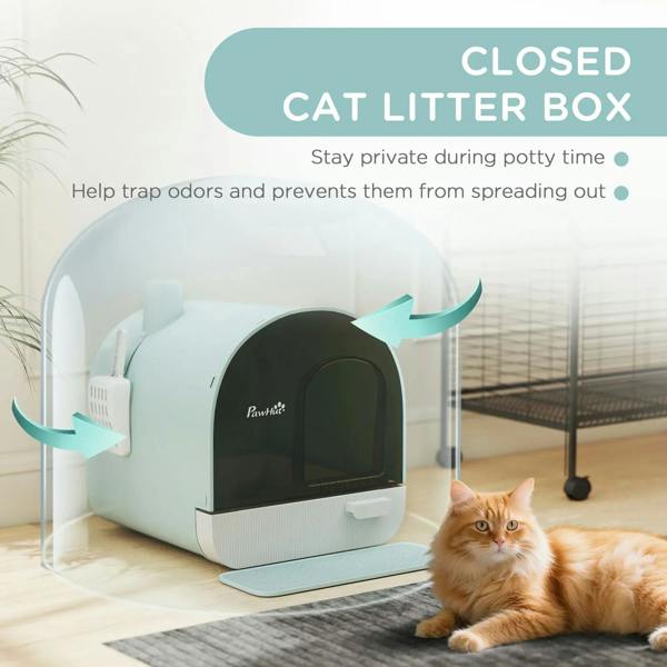 Mint closed hooded cat litter box with scoop holder and door opening; cat resting nearby