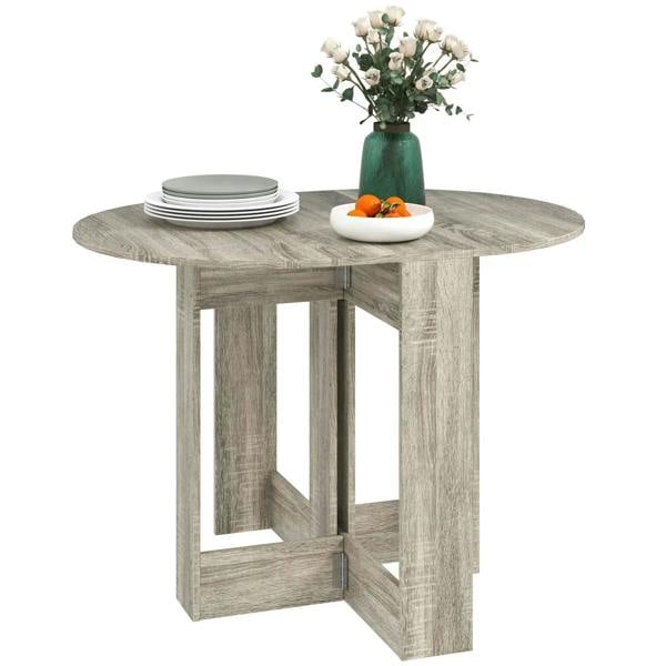 Grey round folding drop-leaf dining table with wood-look finish and pedestal base.