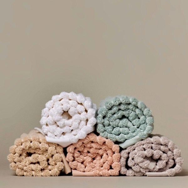 Ribbed organic cotton bathroom towels, super soft, textured design.