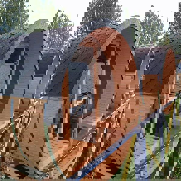 Wooden barrel saunas by the water