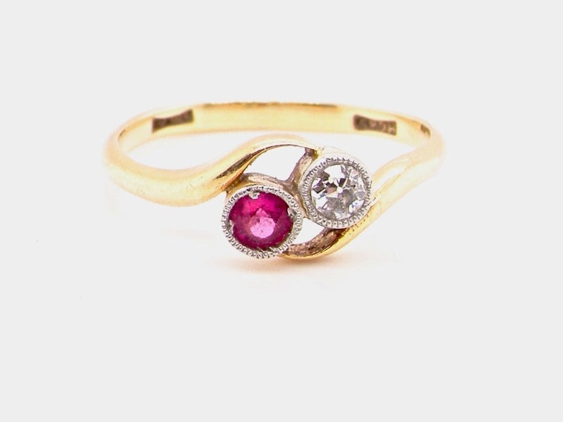 Vintage Tom A vintage two stone ruby and diamond cross over ring