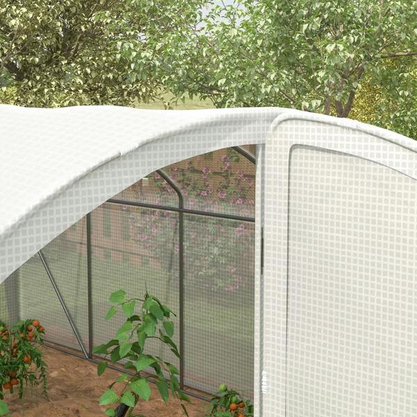 Close-up of white arched greenhouse side wall with mesh cover and steel frame