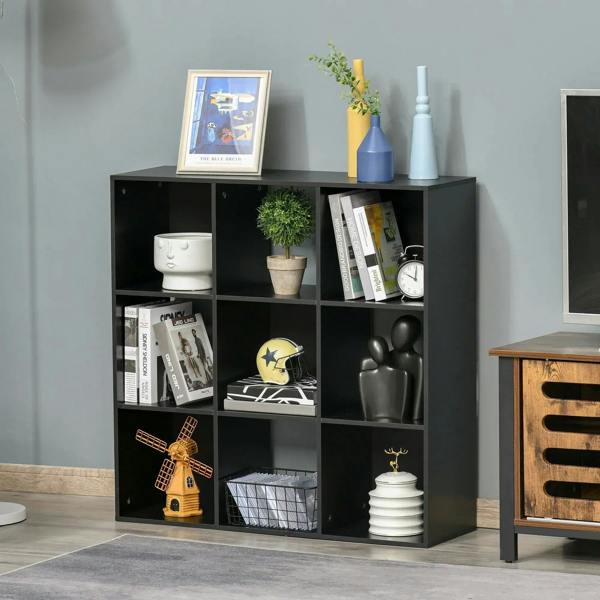 Black 9-cube storage cabinet with open cubbies, styling shelves with books and vases