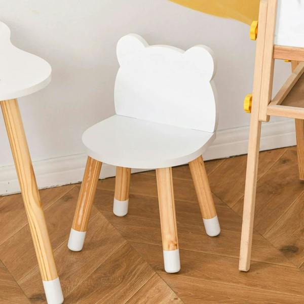 White bear-shaped kids chair with padded seat and light wood legs