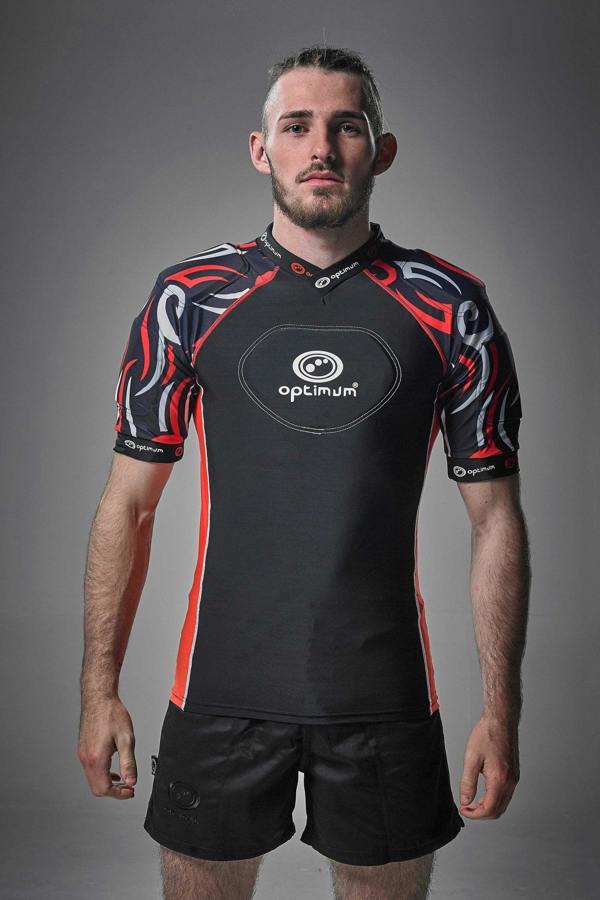 Black Optimum Razor protective top with red and white tribal-print padded shoulders, front on model - Optimum