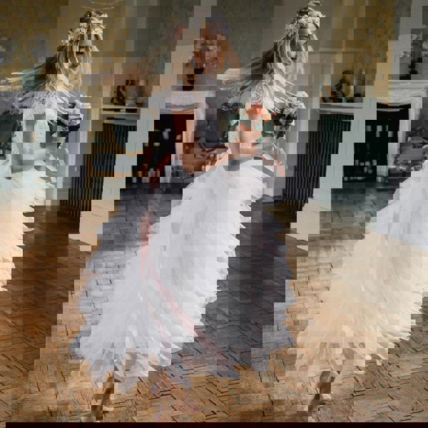 Girl wearing dress and holding flower bouquet