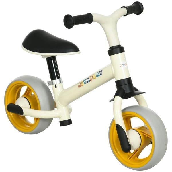 Children's balance bike with cream frame, black seat, and yellow EVA wheels