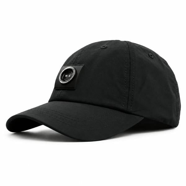 Black Marshall Artist Siren nylon ripstop baseball cap with a signature circular M.A. logo patch on the front.