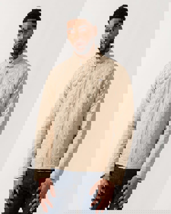 Model wearing GANT Mens Quilted Windcheater Jacket in 200 Oat Beige - closed jacket