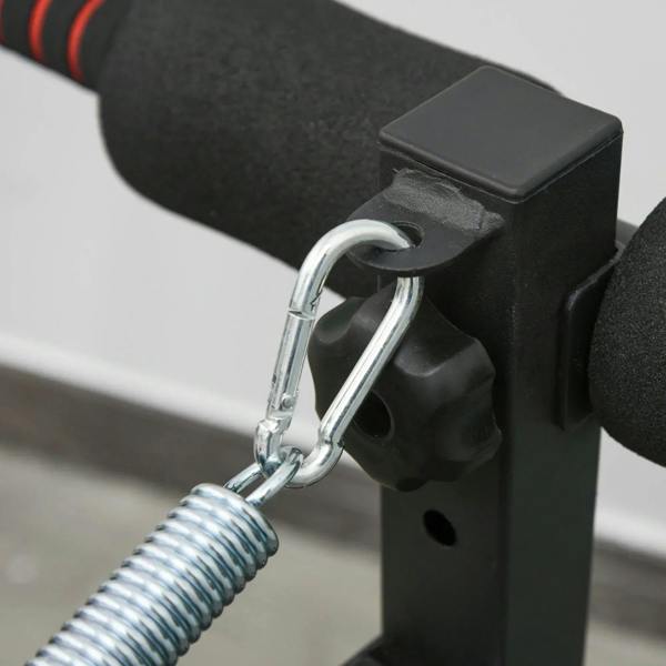 Metal spring connector and loop on black resistance rope for sit-up bench
