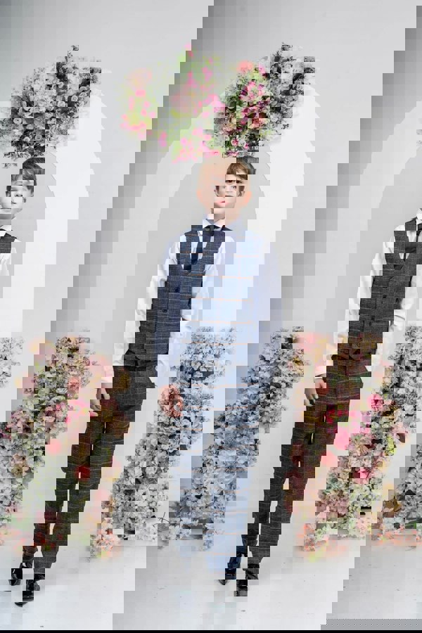 young boy modelling suit
