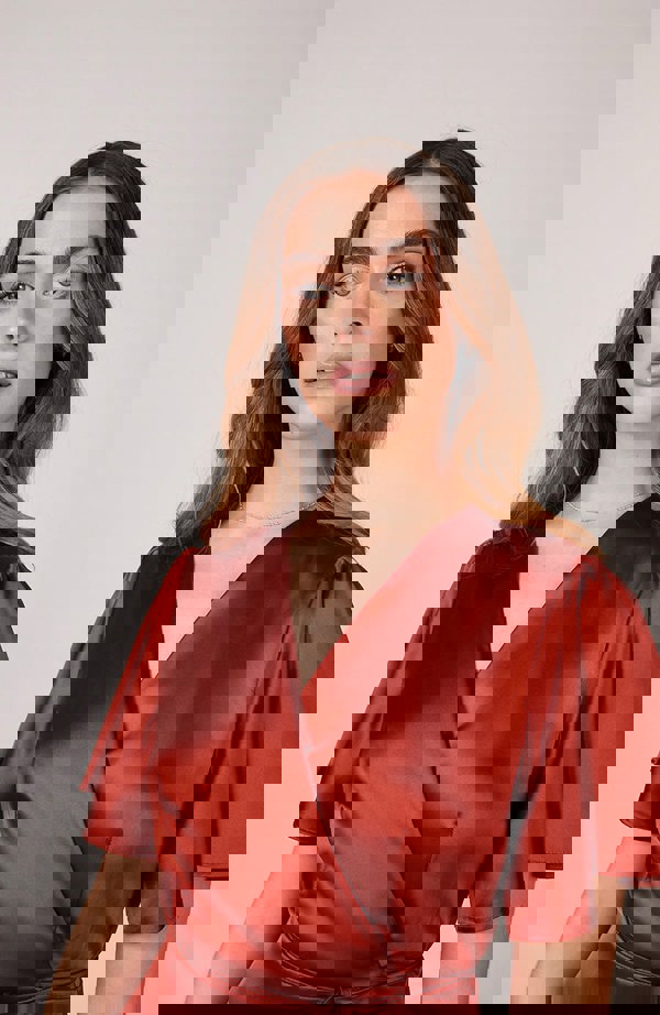 Satin wrap bridesmaids dress in burnt orange with a short sleeve A beautiful rich copper rust colour, this dress is a modern and stylish option for all occasions.