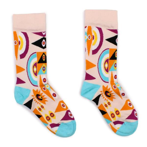 Light pink bamboo crew socks with colorful evil eye and psychedelic patterns