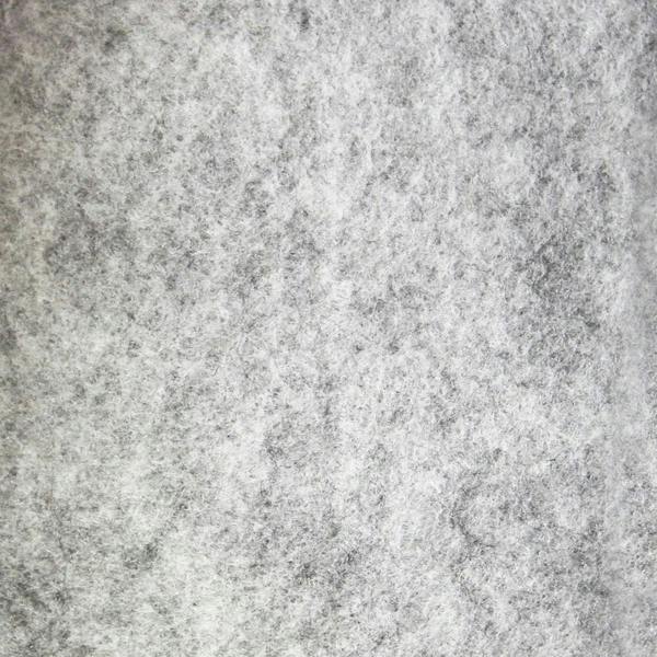 Textured silver van lining material showcasing a soft, felt-like surface, ideal for VW Caddy racking unit installation