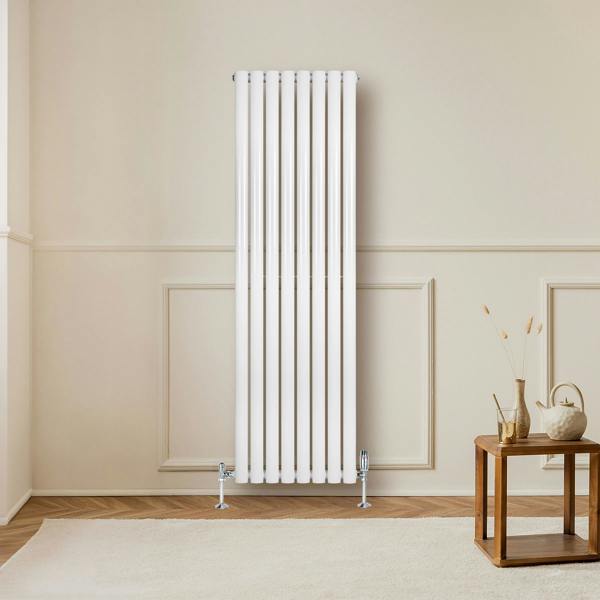 Sleek white oval single column radiator, 1600 x 480mm, mounted on a wall, enhancing a modern living space with warm tones and textures