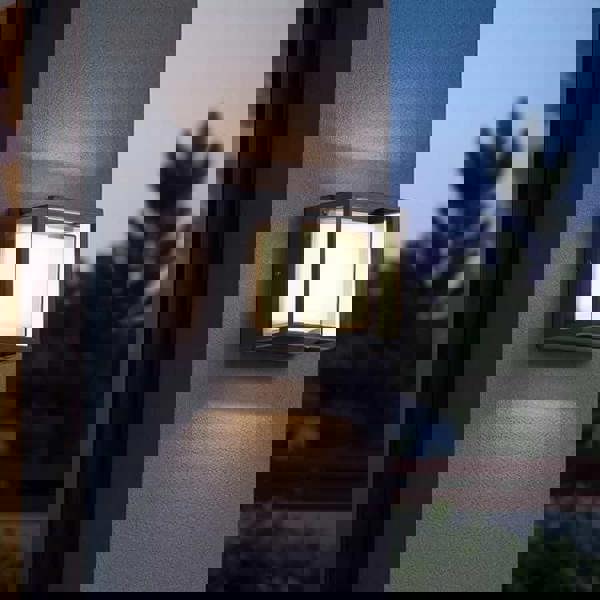 black square outside wall light mounted omn the outdoor wall of a modern home 