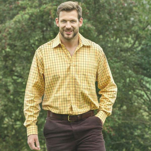Man wearing Hoggs of Fife Governor Tattersall shirt in the countryside, classic check style for shooting, farming, or rural events