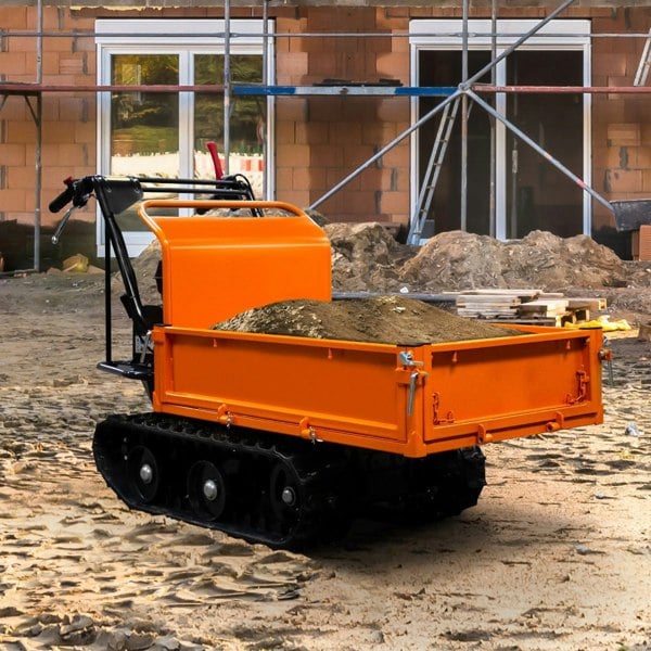 Tracked Mini Dumper Petrol Transporter with an orange metal body, black tracks, and a loaded bed of dirt on a construction site