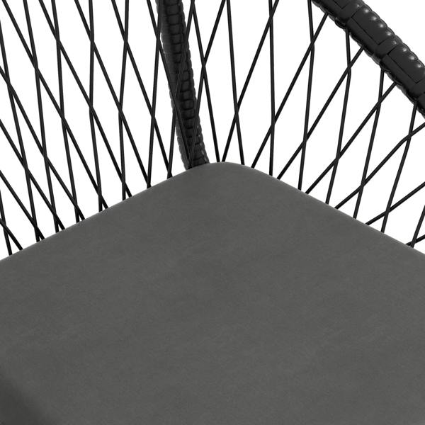 Black rattan armchair seat cushion close-up with smooth fabric surface