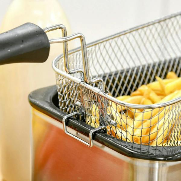 Wire frying basket with handle set in stainless steel deep fryer pot