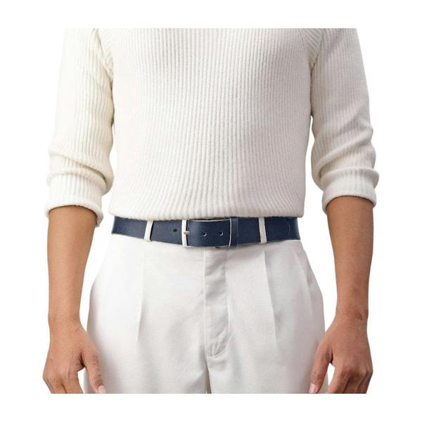 Person wearing a white sweater, white pants, and a blue belt on a white background